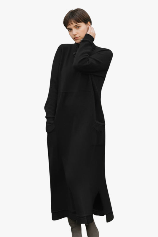 Woman wearing a black coat on a white background