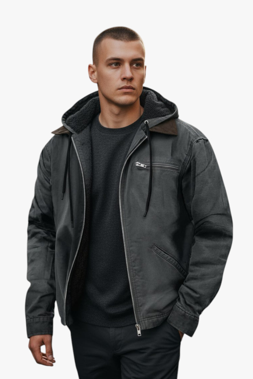 Man wearing a dark gray jacket with a hood on a white background