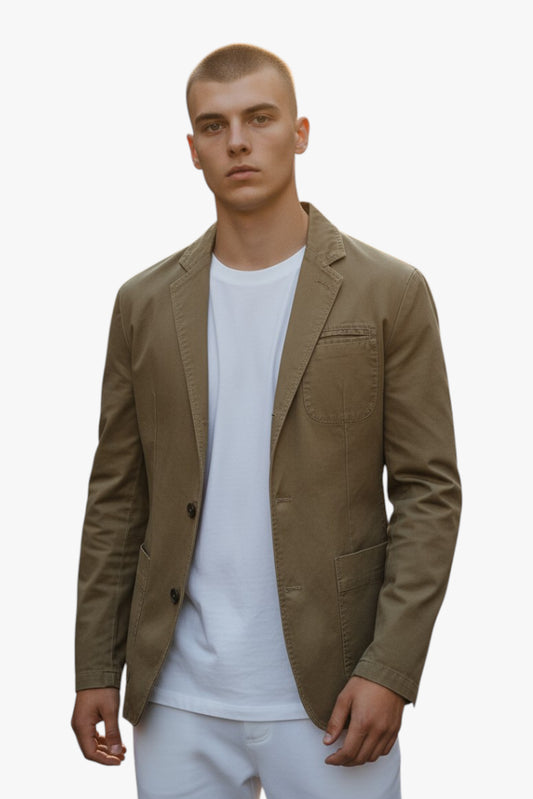 Man wearing a brown blazer over a white shirt on a white background