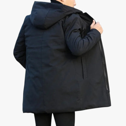 Person wearing a black coat on a white background