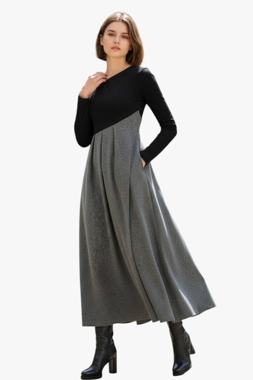 Woman wearing a black and gray dress on a white background