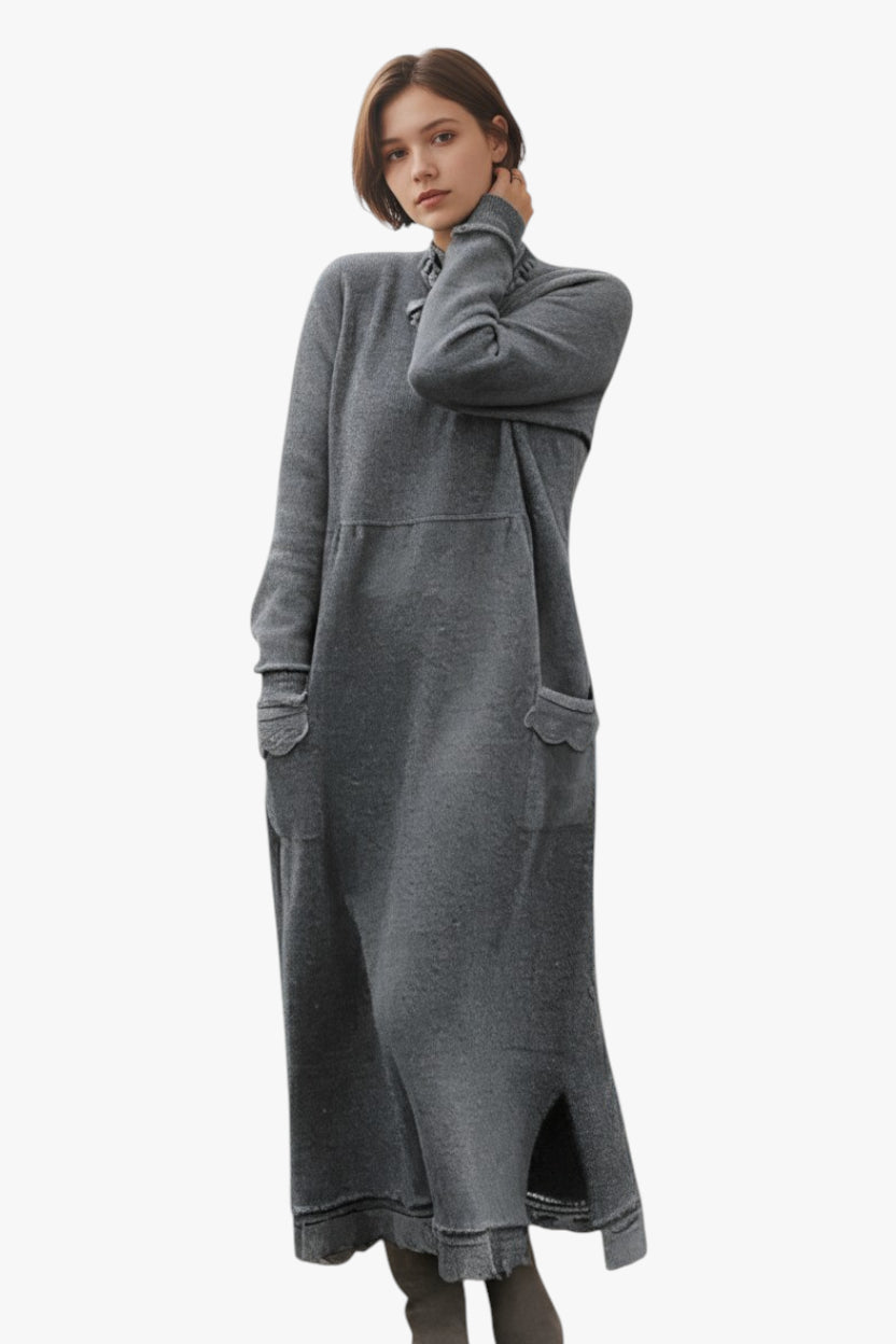 Woman wearing a long gray dress on a white background