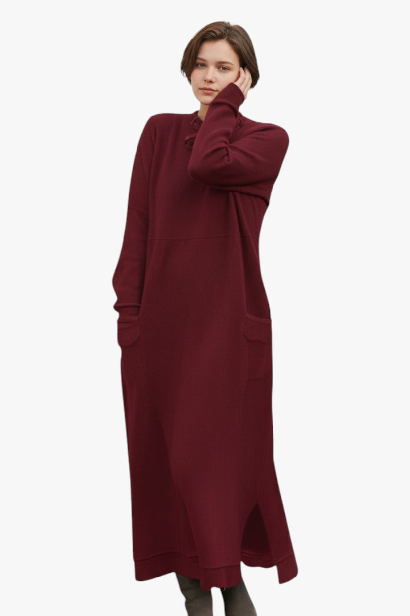 Woman wearing a burgundy dress on a white background