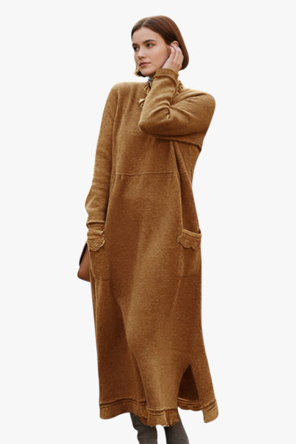 Woman wearing a long brown dress on a white background