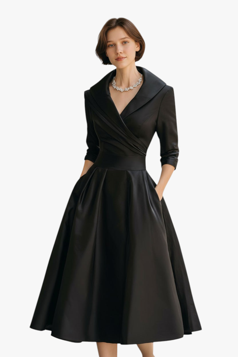 Woman wearing a black dress with a white background